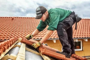 Roofer Inspecting Tile Roof Underlayment