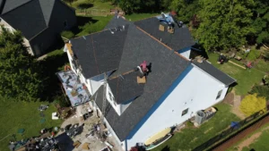 Roofing Crew Completing A Roof Replacement Project